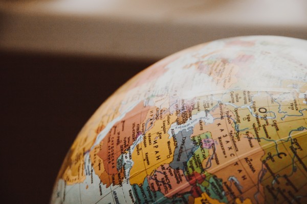 image of part of a globe in non-latin script Photo by NastyaSensei: https://www.pexels.com/photo/close-up-of-globe-335393/