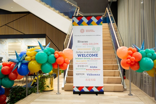 Welcome sign by colored balloons at Global Tastes 2022