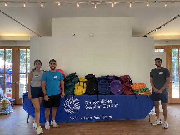 Back to school volunteer event with backpacks distributed to clients' children