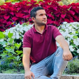 Reza Saber looking to the right